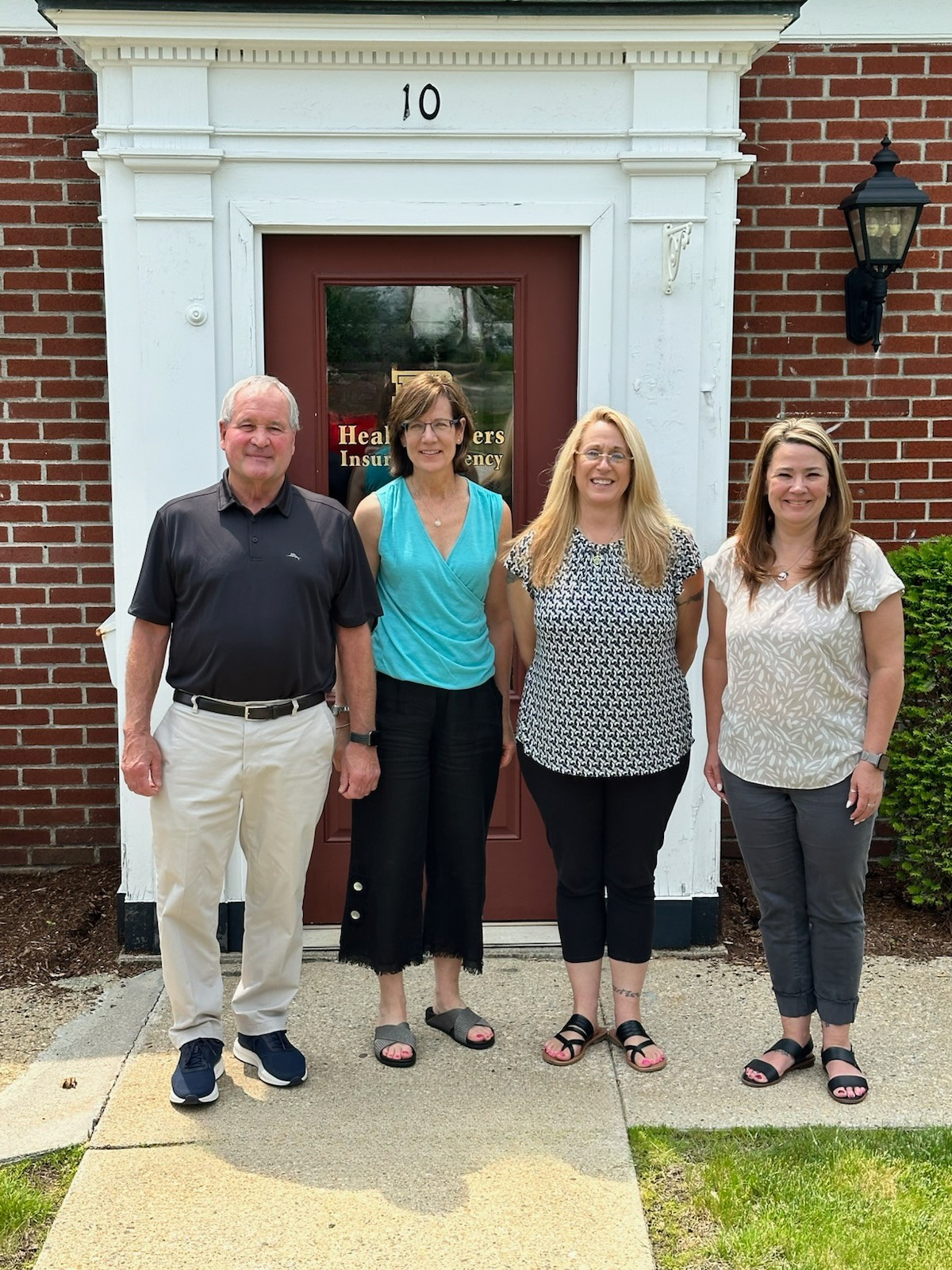 Healy Brothers Insurance team in front of the Barre, MA office